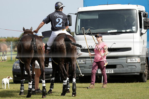 Maiz Dulce (green) v River (blue) in a Uber Polo Midsummer 12 goal polo match on Wednesday 21 August 2013 at Cowdray park Polo Club on Ambersham 2.  www.polopictures.co.uk