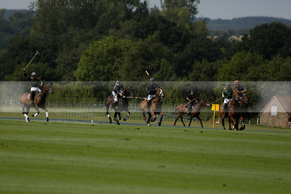 Maiz Dulce (green) v River (blue) in a Uber Polo Midsummer 12 goal polo match on Wednesday 21 August 2013 at Cowdray park Polo Club on Ambersham 2.  www.polopictures.co.uk