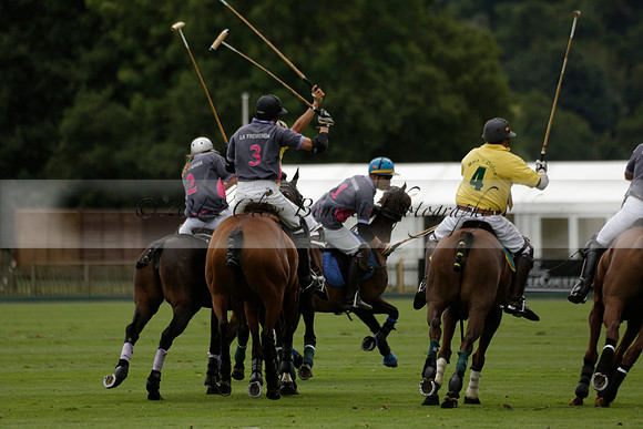 La Tremenda (lilac) v Maiz Dulce (yellow) in a Brecknock Cup polo match played on Lawns 1 at the Cowdray Park Polo Club on Tuesday 13 August 2013