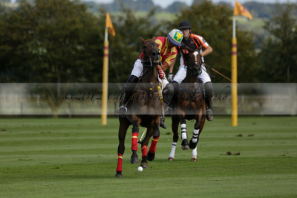 Four Quarters Black (black) v BHC (red) in a Autumn Cup polo match on Ambersham 2 at Cowdray Park Polo Club on Friday 20 September 2013 www.polopictures.co.uk