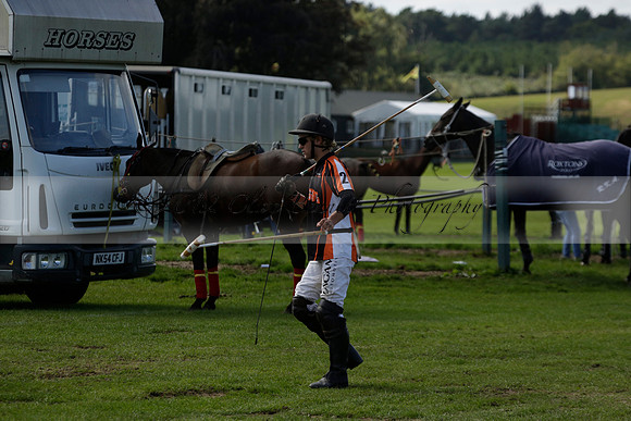 Four Quarters Black (black) v BHC (red) in a Autumn Cup polo match on Ambersham 2 at Cowdray Park Polo Club on Friday 20 September 2013 www.polopictures.co.uk