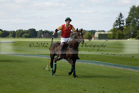 Four Quarters Black (black) v BHC (red) in a Autumn Cup polo match on Ambersham 2 at Cowdray Park Polo Club on Friday 20 September 2013 www.polopictures.co.uk