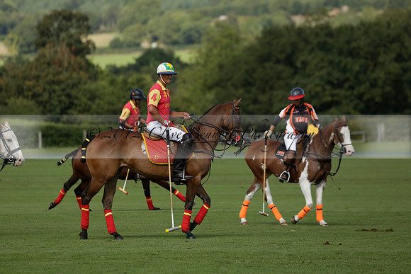 Four Quarters Black (black) v BHC (red) in a Autumn Cup polo match on Ambersham 2 at Cowdray Park Polo Club on Friday 20 September 2013 www.polopictures.co.uk