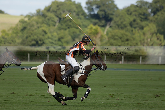 Four Quarters Black (black) v BHC (red) in a Autumn Cup polo match on Ambersham 2 at Cowdray Park Polo Club on Friday 20 September 2013 www.polopictures.co.uk