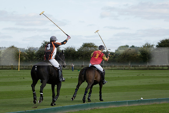 Four Quarters Black (black) v BHC (red) in a Autumn Cup polo match on Ambersham 2 at Cowdray Park Polo Club on Friday 20 September 2013 www.polopictures.co.uk