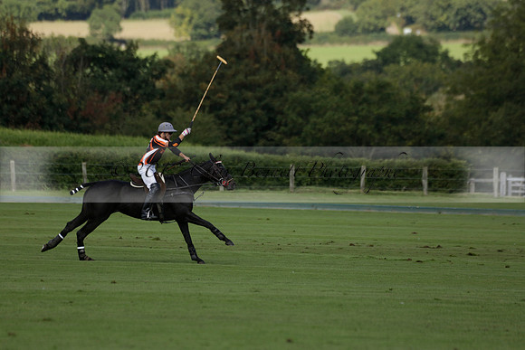 Four Quarters Black (black) v BHC (red) in a Autumn Cup polo match on Ambersham 2 at Cowdray Park Polo Club on Friday 20 September 2013 www.polopictures.co.uk
