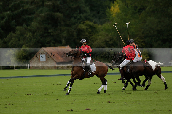 Four Quarters Black (black) v Clashleigh (red) in the Autumn Cup subsidiary final polo match on Ambersham 2 at Cowdray Park Polo Club on Sunday 22 September 2013 www.polopictures.co.uk