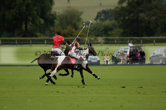 Four Quarters Black (black) v Clashleigh (red) in the Autumn Cup subsidiary final polo match on Ambersham 2 at Cowdray Park Polo Club on Sunday 22 September 2013 www.polopictures.co.uk