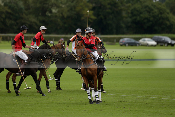 Four Quarters Black (black) v Clashleigh (red) in the Autumn Cup subsidiary final polo match on Ambersham 2 at Cowdray Park Polo Club on Sunday 22 September 2013 www.polopictures.co.uk