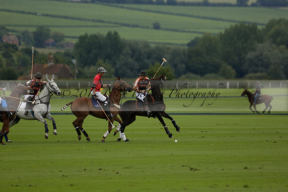Four Quarters Black (black) v Clashleigh (red) in the Autumn Cup subsidiary final polo match on Ambersham 2 at Cowdray Park Polo Club on Sunday 22 September 2013 www.polopictures.co.uk