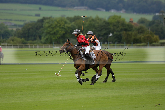 Four Quarters Black (black) v Clashleigh (red) in the Autumn Cup subsidiary final polo match on Ambersham 2 at Cowdray Park Polo Club on Sunday 22 September 2013 www.polopictures.co.uk
