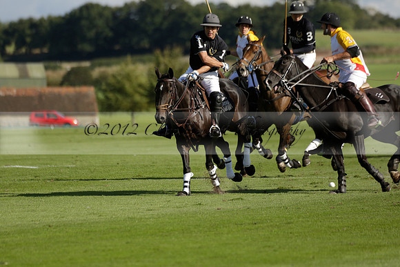 Aryana (black) v Shoreline (yellow) in a Farewell Cup polo match played on Ambersham 5 at Cowdray Park Polo Club on Wednesday 18 September 2013. www.polopictures.co.uk