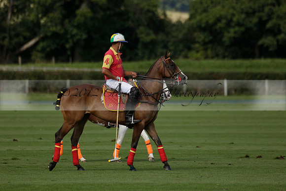 Four Quarters Black (black) v BHC (red) in a Autumn Cup polo match on Ambersham 2 at Cowdray Park Polo Club on Friday 20 September 2013 www.polopictures.co.uk