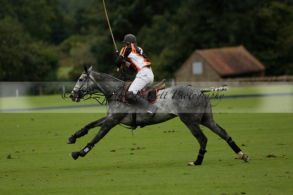 Four Quarters Black (black) v Clashleigh (red) in the Autumn Cup subsidiary final polo match on Ambersham 2 at Cowdray Park Polo Club on Sunday 22 September 2013 www.polopictures.co.uk