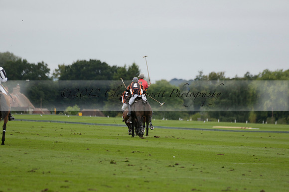 Four Quarters Black (black) v Clashleigh (red) in the Autumn Cup subsidiary final polo match on Ambersham 2 at Cowdray Park Polo Club on Sunday 22 September 2013 www.polopictures.co.uk