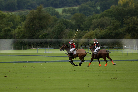 Four Quarters Black (black) v Clashleigh (red) in the Autumn Cup subsidiary final polo match on Ambersham 2 at Cowdray Park Polo Club on Sunday 22 September 2013 www.polopictures.co.uk