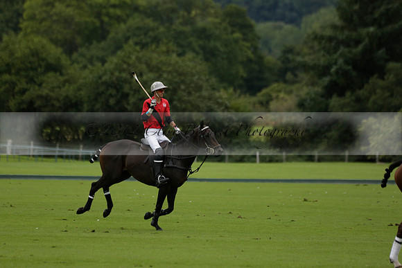 Four Quarters Black (black) v Clashleigh (red) in the Autumn Cup subsidiary final polo match on Ambersham 2 at Cowdray Park Polo Club on Sunday 22 September 2013 www.polopictures.co.uk