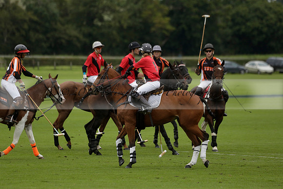 Four Quarters Black (black) v Clashleigh (red) in the Autumn Cup subsidiary final polo match on Ambersham 2 at Cowdray Park Polo Club on Sunday 22 September 2013 www.polopictures.co.uk