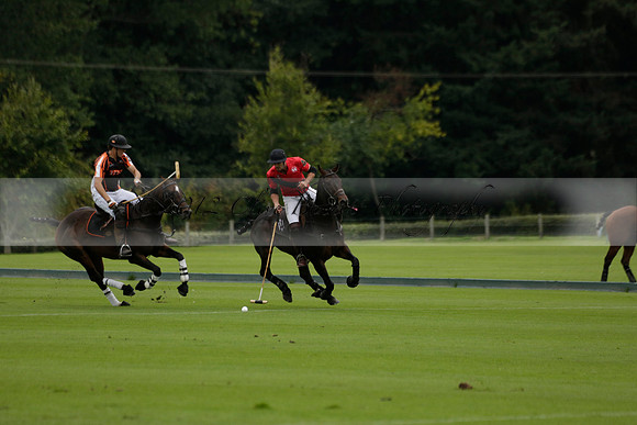 Four Quarters Black (black) v Clashleigh (red) in the Autumn Cup subsidiary final polo match on Ambersham 2 at Cowdray Park Polo Club on Sunday 22 September 2013 www.polopictures.co.uk