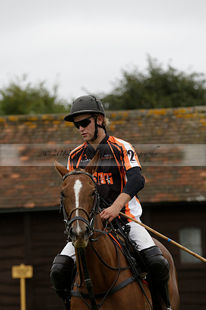 Four Quarters Black (black) v Clashleigh (red) in the Autumn Cup subsidiary final polo match on Ambersham 2 at Cowdray Park Polo Club on Sunday 22 September 2013 www.polopictures.co.uk