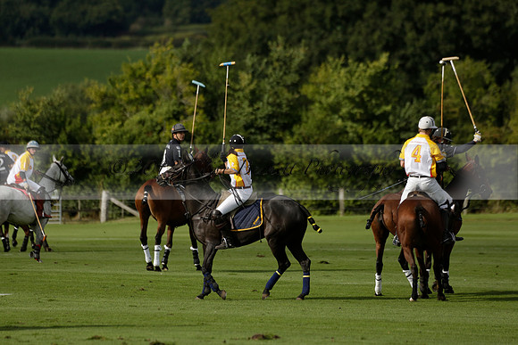 Aryana (black) v Shoreline (yellow) in a Farewell Cup polo match played on Ambersham 5 at Cowdray Park Polo Club on Wednesday 18 September 2013. www.polopictures.co.uk