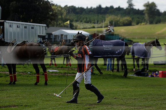 Four Quarters Black (black) v BHC (red) in a Autumn Cup polo match on Ambersham 2 at Cowdray Park Polo Club on Friday 20 September 2013 www.polopictures.co.uk