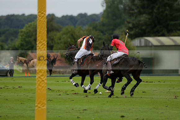 Four Quarters Black (black) v Clashleigh (red) in the Autumn Cup subsidiary final polo match on Ambersham 2 at Cowdray Park Polo Club on Sunday 22 September 2013 www.polopictures.co.uk