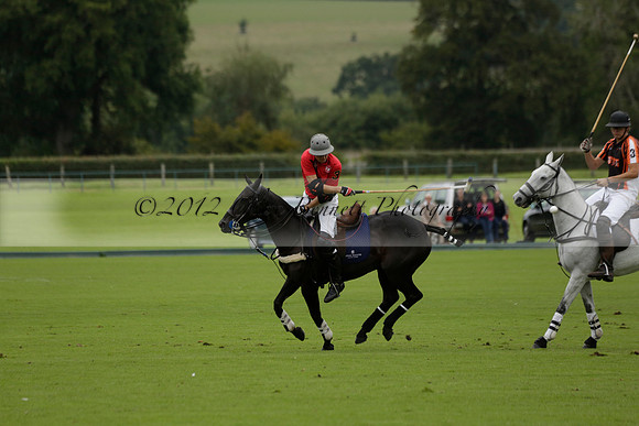 Four Quarters Black (black) v Clashleigh (red) in the Autumn Cup subsidiary final polo match on Ambersham 2 at Cowdray Park Polo Club on Sunday 22 September 2013 www.polopictures.co.uk