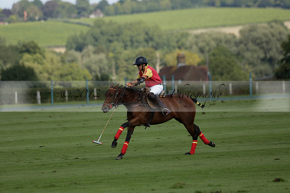Four Quarters Black (black) v BHC (red) in a Autumn Cup polo match on Ambersham 2 at Cowdray Park Polo Club on Friday 20 September 2013 www.polopictures.co.uk