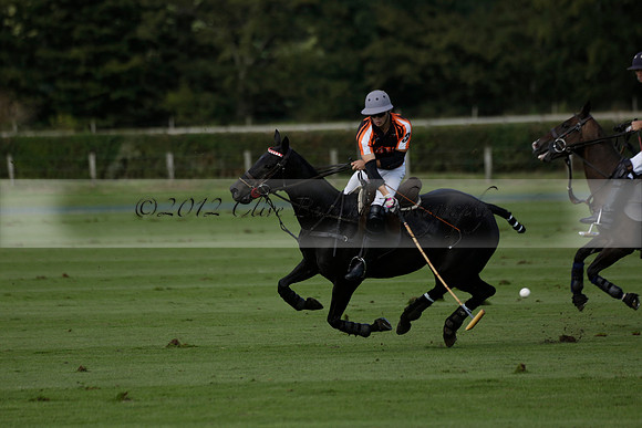 Four Quarters Black (black) v BHC (red) in a Autumn Cup polo match on Ambersham 2 at Cowdray Park Polo Club on Friday 20 September 2013 www.polopictures.co.uk