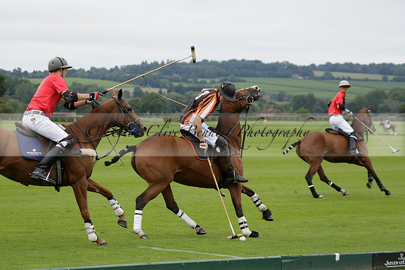 Four Quarters Black (black) v Clashleigh (red) in the Autumn Cup subsidiary final polo match on Ambersham 2 at Cowdray Park Polo Club on Sunday 22 September 2013 www.polopictures.co.uk