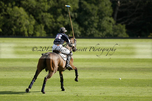 Pandas (white) v Home Farm (navy) in a Park House West Sussex Cup Polo match on Brooksfield at Cowdray Park Polo Club on Friday 30 August 2013. 2013.08.30 www.polopictures.co.uk