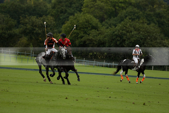 Four Quarters Black (black) v Clashleigh (red) in the Autumn Cup subsidiary final polo match on Ambersham 2 at Cowdray Park Polo Club on Sunday 22 September 2013 www.polopictures.co.uk