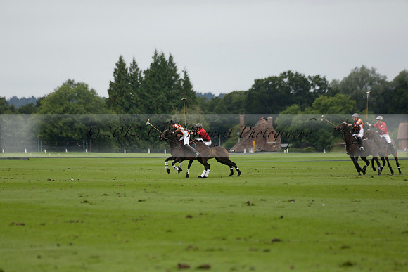 Four Quarters Black (black) v Clashleigh (red) in the Autumn Cup subsidiary final polo match on Ambersham 2 at Cowdray Park Polo Club on Sunday 22 September 2013 www.polopictures.co.uk