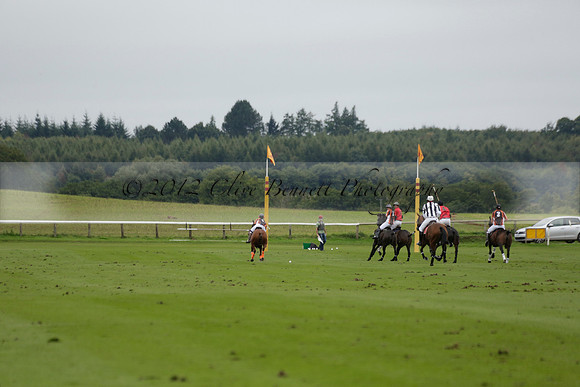 Four Quarters Black (black) v Clashleigh (red) in the Autumn Cup subsidiary final polo match on Ambersham 2 at Cowdray Park Polo Club on Sunday 22 September 2013 www.polopictures.co.uk