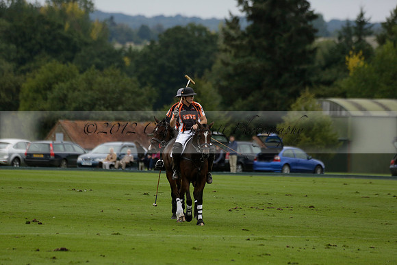 Four Quarters Black (black) v Clashleigh (red) in the Autumn Cup subsidiary final polo match on Ambersham 2 at Cowdray Park Polo Club on Sunday 22 September 2013 www.polopictures.co.uk