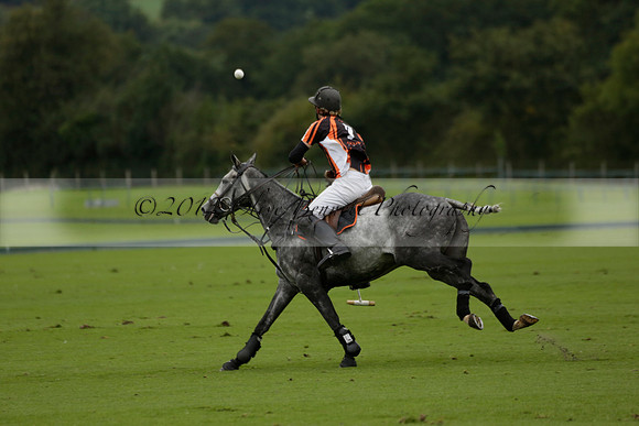 Four Quarters Black (black) v Clashleigh (red) in the Autumn Cup subsidiary final polo match on Ambersham 2 at Cowdray Park Polo Club on Sunday 22 September 2013 www.polopictures.co.uk