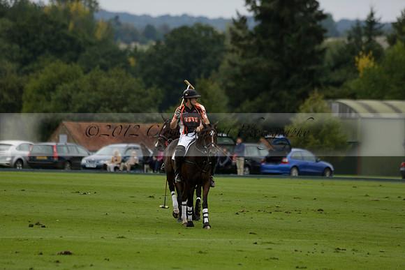 Four Quarters Black (black) v Clashleigh (red) in the Autumn Cup subsidiary final polo match on Ambersham 2 at Cowdray Park Polo Club on Sunday 22 September 2013 www.polopictures.co.uk