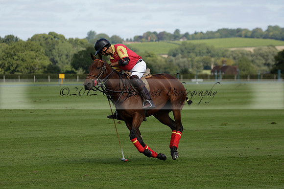 Four Quarters Black (black) v BHC (red) in a Autumn Cup polo match on Ambersham 2 at Cowdray Park Polo Club on Friday 20 September 2013 www.polopictures.co.uk