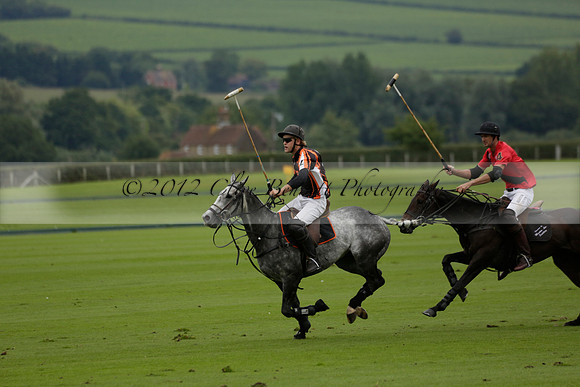 Four Quarters Black (black) v Clashleigh (red) in the Autumn Cup subsidiary final polo match on Ambersham 2 at Cowdray Park Polo Club on Sunday 22 September 2013 www.polopictures.co.uk