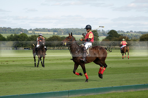Four Quarters Black (black) v BHC (red) in a Autumn Cup polo match on Ambersham 2 at Cowdray Park Polo Club on Friday 20 September 2013 www.polopictures.co.uk