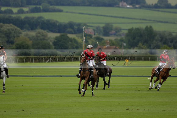Four Quarters Black (black) v Clashleigh (red) in the Autumn Cup subsidiary final polo match on Ambersham 2 at Cowdray Park Polo Club on Sunday 22 September 2013 www.polopictures.co.uk