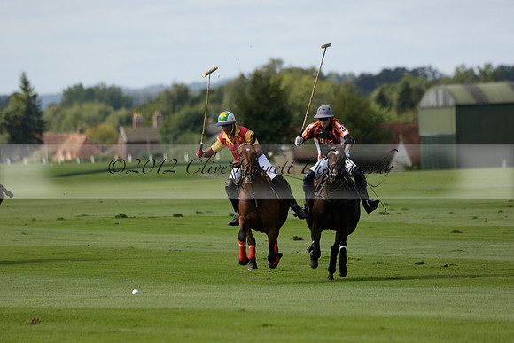 Four Quarters Black (black) v BHC (red) in a Autumn Cup polo match on Ambersham 2 at Cowdray Park Polo Club on Friday 20 September 2013 www.polopictures.co.uk
