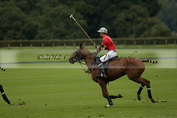 Four Quarters Black (black) v Clashleigh (red) in the Autumn Cup subsidiary final polo match on Ambersham 2 at Cowdray Park Polo Club on Sunday 22 September 2013 www.polopictures.co.uk
