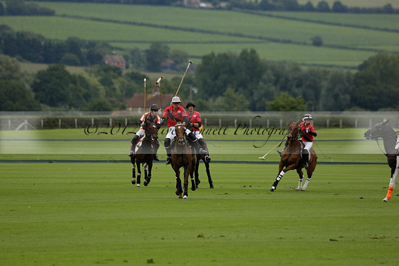 Four Quarters Black (black) v Clashleigh (red) in the Autumn Cup subsidiary final polo match on Ambersham 2 at Cowdray Park Polo Club on Sunday 22 September 2013 www.polopictures.co.uk