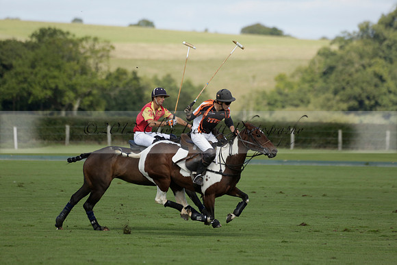 Four Quarters Black (black) v BHC (red) in a Autumn Cup polo match on Ambersham 2 at Cowdray Park Polo Club on Friday 20 September 2013 www.polopictures.co.uk