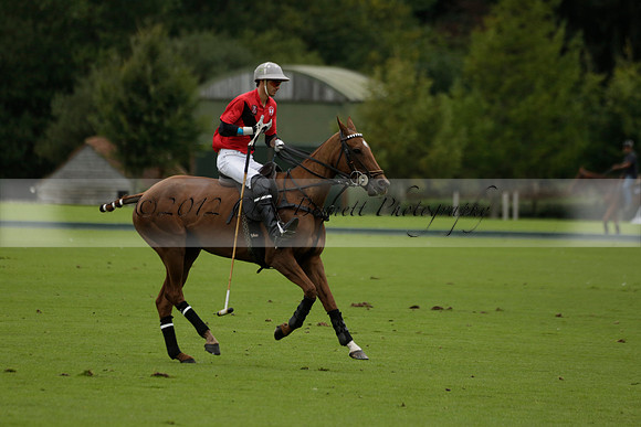 Four Quarters Black (black) v Clashleigh (red) in the Autumn Cup subsidiary final polo match on Ambersham 2 at Cowdray Park Polo Club on Sunday 22 September 2013 www.polopictures.co.uk