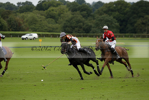 Four Quarters Black (black) v Clashleigh (red) in the Autumn Cup subsidiary final polo match on Ambersham 2 at Cowdray Park Polo Club on Sunday 22 September 2013 www.polopictures.co.uk