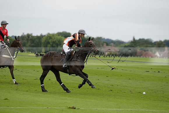 Four Quarters Black (black) v Clashleigh (red) in the Autumn Cup subsidiary final polo match on Ambersham 2 at Cowdray Park Polo Club on Sunday 22 September 2013 www.polopictures.co.uk