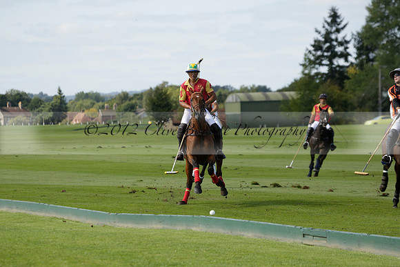 Four Quarters Black (black) v BHC (red) in a Autumn Cup polo match on Ambersham 2 at Cowdray Park Polo Club on Friday 20 September 2013 www.polopictures.co.uk